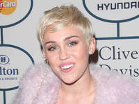 Miley Cyrus blasts unkind critics from sick bed